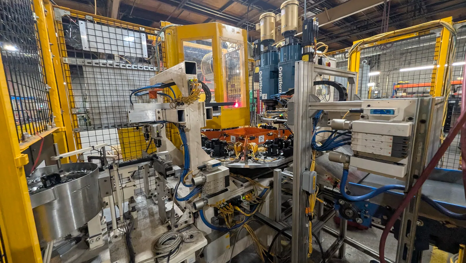 Automated sub-assembly cell — rotary indexing station with servo-driven stations and guarding.