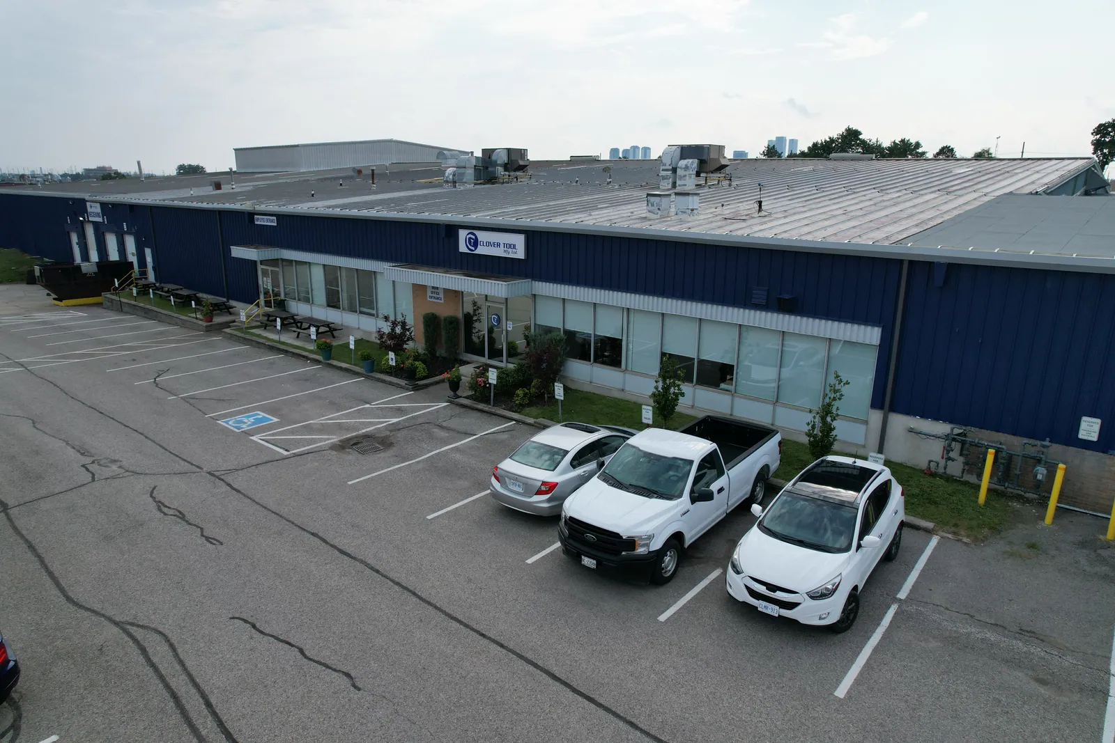 The Clover Tool Mfg. plant in Concord, Ontario — aerial view of the facility and signed main entrance.